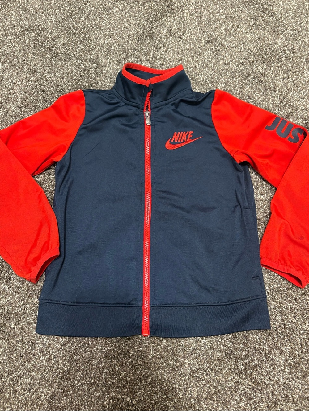 Nike Kids Navy Jacket with Red Sleeves and Trim